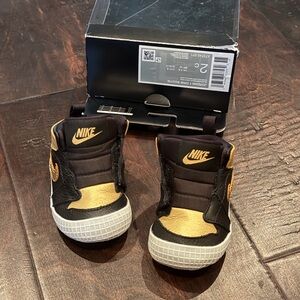 Nike Kids Black and Gold 1’s